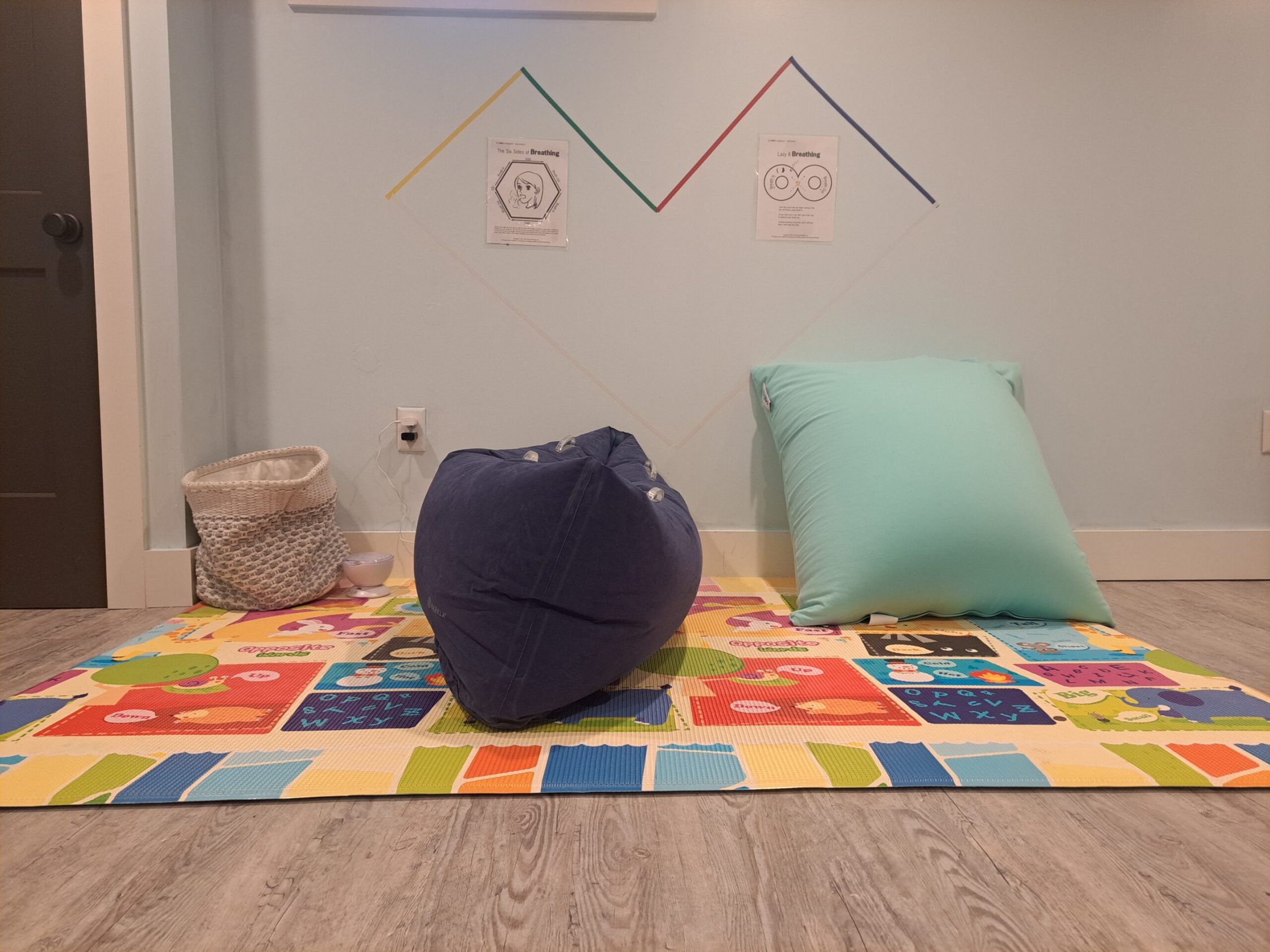 Children's playroom with colorful mat and bean bag chair
